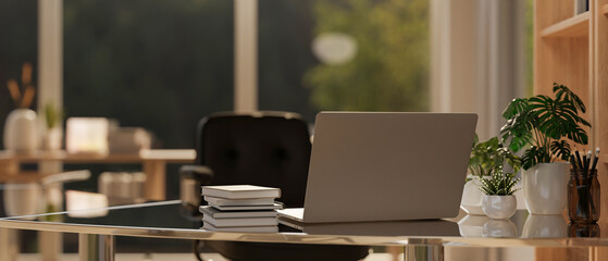 A back view image of a laptop computer on a modern office desk in a contemporary office room.