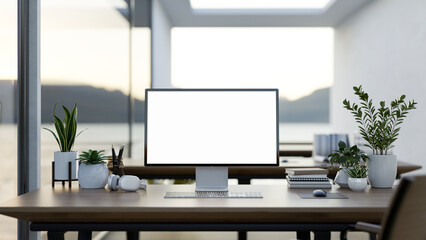 A computer desk in a modern office surrounded by large windows with a lake view, a computer mockup