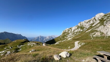 mountains and clouds Mangart Julian Alps 2,679 meters peak hiking nature Slovenia
