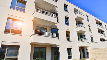 Fototapeta premium Modern architecture of urban residential apartment buildings on a sunny day. Facade of a modern apartment building.