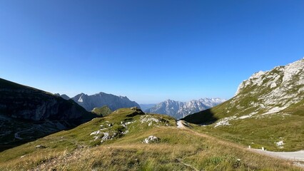 mountains and clouds Mangart Julian Alps 2,679 meters peak hiking nature Slovenia

