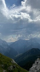 mountains and clouds Mangart Julian Alps 2,679 meters peak hiking nature Slovenia