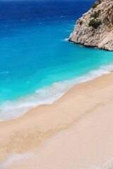 Pristine beach with turquoise waters.