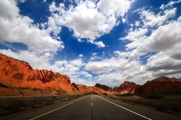 Desert road through red rock canyon.