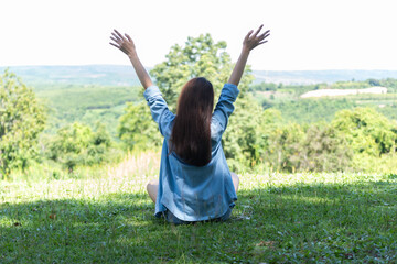 Women with mobile phones and tablets in the beautiful backyard.