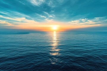 Fototapeta premium Sunset over ocean on cloudy day