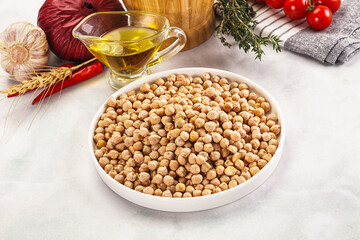 Dry chickpea seeds heap in the bowl