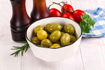 Green marinated olives in the bowl