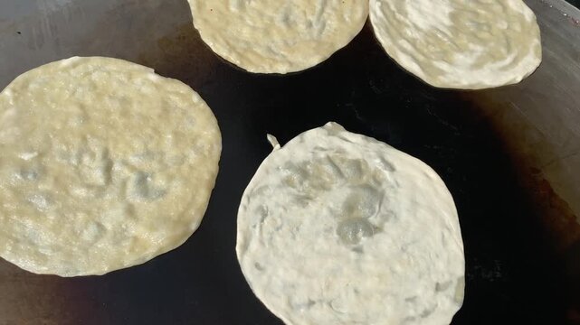The Making of Paratha at a Local Restaurant in Multan Pakistan for Breakfast