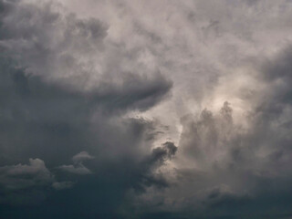 Dark and dramatic storm looking cloudy sky. Nature background.