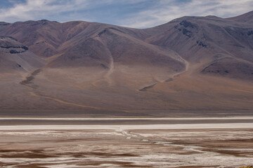 Driving east on Route 27 in the Atacama Desert you see amazing sights like the stunning views across the Salar de Aguas Calientes.