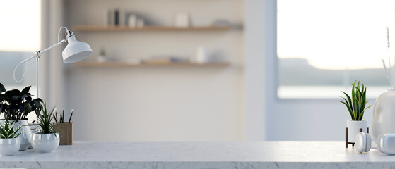 A copy space for displaying products on a white marble table in a minimalist white room.