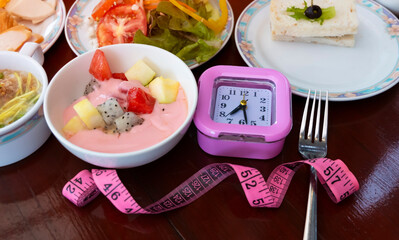 Alarm clock with IF (Intermittent Fasting) 16 and 8 diet rule and weight loss concept.-Diet plan concept