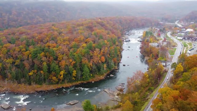 Aerial view the Laurel Highland mountains during fall season with yellow golden leaves, Ferncliff peninsula natural area in fall. Ohiopyle Falls in the Fall. Ohiopyle State Park in Pennsylvania. .