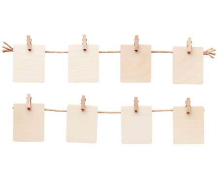 Wooden clips holding blank cards on a string, perfect for notes, messages, or craft projects in a minimalistic style.