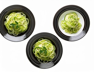 Obraz premium Three plates with zucchini noodles isolated on transparent background, vegetarian food, top view