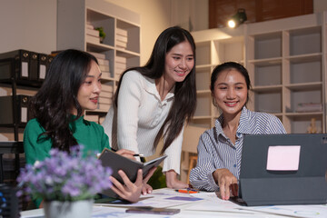 Businesswoman teamwork discussing brainstorming and calculating with calculator on evaluation data in conference room Focus on business growth and point out financial accounting charts.