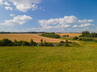 Fototapeta premium Panorama view from above of a summer landscape. Agriculture, green fields