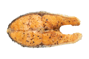 Top view of pan fried salmon fish steak isolated on transparent background