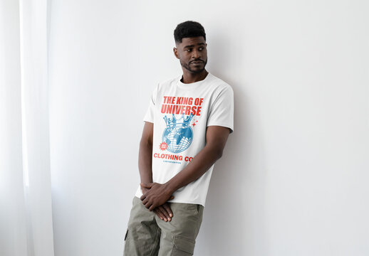 Mockup Of Man Wearing Customized T-Shirt Leaning Against Wall