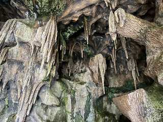 Geological cave with natural erosion in the rock and stalactites