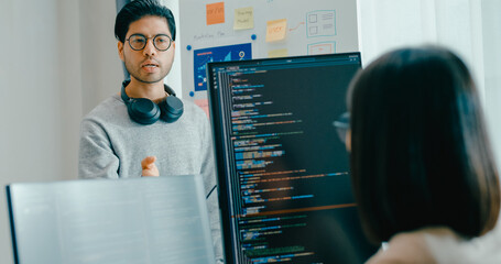 Group adult Asia male female software developers mentor leader manager talk strategy plan to executive write prompt AI bot IT app program nomad, video game, data center. Whiteboard slideshow code.