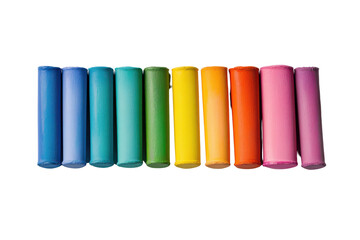 Fototapeta premium Colorful cylindrical objects arranged in a gradient, perfect for creative projects, teaching materials, or artistic displays.