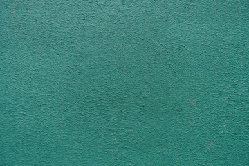 Close view of dark teal green painted wall