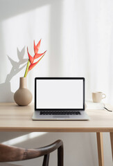 Laptop computer with empty blank mockup screen over white modern living room design. Advertisement,...