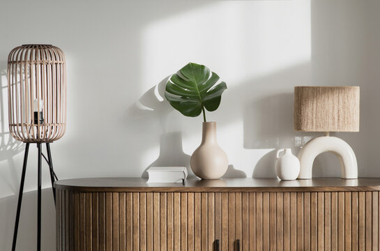 View of modern scandinavian style interior with lamp and trendy vase, Home staging and minimalism concept