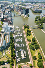 High top panoramic wide angle view of city buildings, river and media harbour from Dusseldorf Rhine Tower in North Rhine-Westphalia, Germany