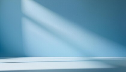 Obraz premium Empty room minimalistic light blue background for product presentation with shadow and light from windows