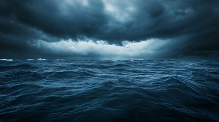 Fototapeta premium Dark sea surface with a dramatic cloudy sky above. Approaching storm