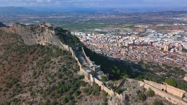 Aerial footage of Xativa Castle on a sunny day in the city of Xativa near Valencia, Spain