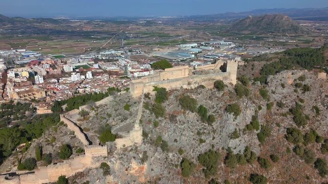 Aerial footage of the Xativa Castle on a sunny day in the city of Xativa near Valencia, Spain