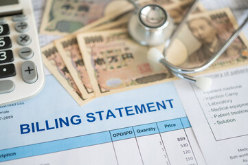 billing statement medical document and Japanese Yen money, calculator, stethoscope. medical treatment expense concept.