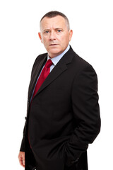 Confident senior businessman standing isolated on white