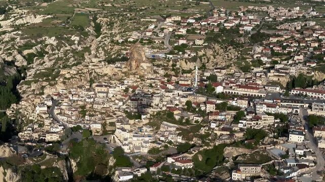 Aerial footage of the cityscape of Ortahisar on a sunny day in Nevsehir Province, Cappadocia, Turkey