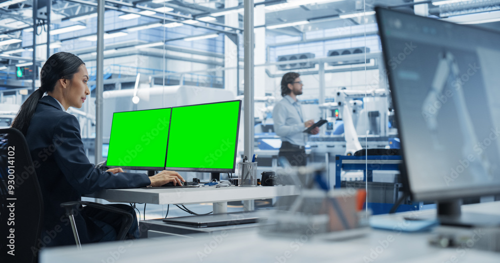 Aufkleber Female Robotics Technician Working on Desktop Computer with Green Screen Chromakey Mock Up Display in a Factory Office. Technological Research and Development Facility with Autonomous Assembly Line