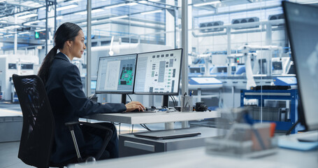 Asian Industrial Engineer Doing Creative Work on Computer in Office. Intelligent Female Creating an Innovative Motherboard with Powerful Microchips for Artificial Intelligence Systems
