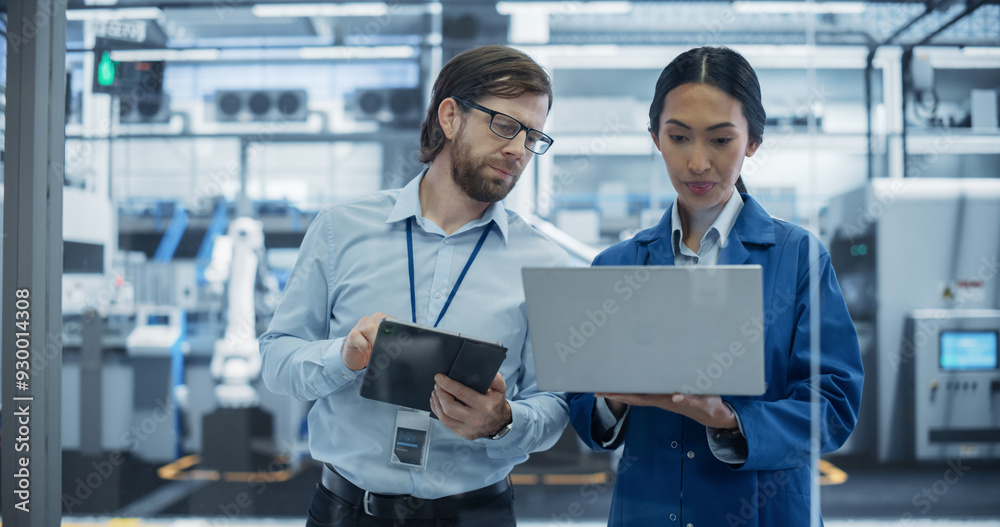 Aufkleber Caucasian Engineer and Asian Female Project Manager Standing in Office, Talking and Using Computers and Monitoring Production at Modern Automated Electronics Manufacture with AI Robotic Arms