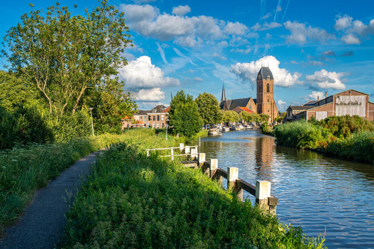 Townscape of Oudewater, Province Utrecht, The Netherlands. View of the St Michael's Church by Hollandse Ijssel river