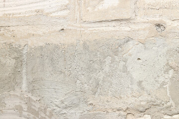 Texture of a wall with putty, concrete. Background of the exterior wall of a house during...