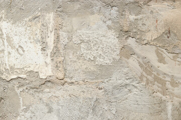 Texture of a wall with putty, concrete. Background of the exterior wall of a house during construction. Background of unfinished exterior gray wall
