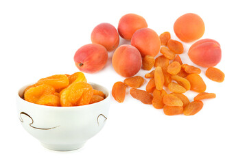 Ripe juicy apricots and dried apricots isolated on white. Collage.