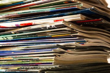 Close-up. Background. Stack of old colorful magazines