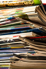Close-up. Background. Stack of old colorful magazines