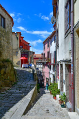 Facade of colorful buildings among the streets of the old city in Porto, Portugal.