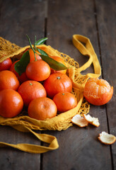 tangerines in a grid on a wooden background