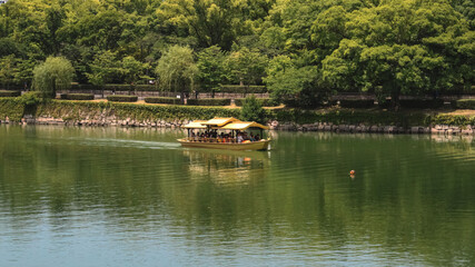 Obraz premium Boats on the moat of Osaka Castle.